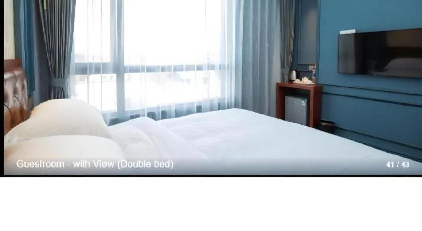 Bed in Yitingzhenshe Hotel Beijing Qianmen