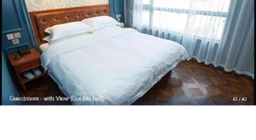 Bed in Yitingzhenshe Hotel Beijing Qianmen Bed in Yitingzhenshe Hotel Beijing Qianmen