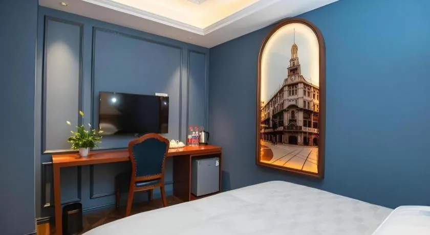 Bed in Yitingzhenshe Hotel Beijing Qianmen