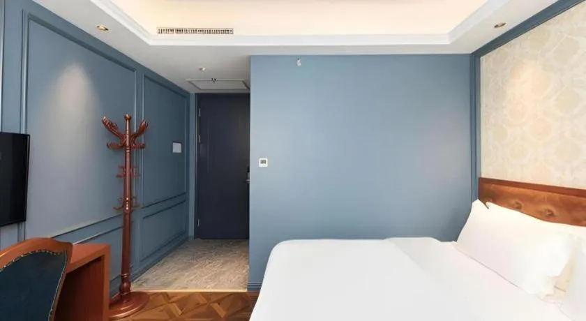 Bed in Yitingzhenshe Hotel Beijing Qianmen