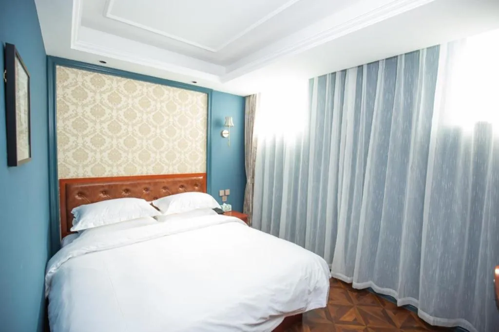 Bed in Yitingzhenshe Hotel Beijing Qianmen