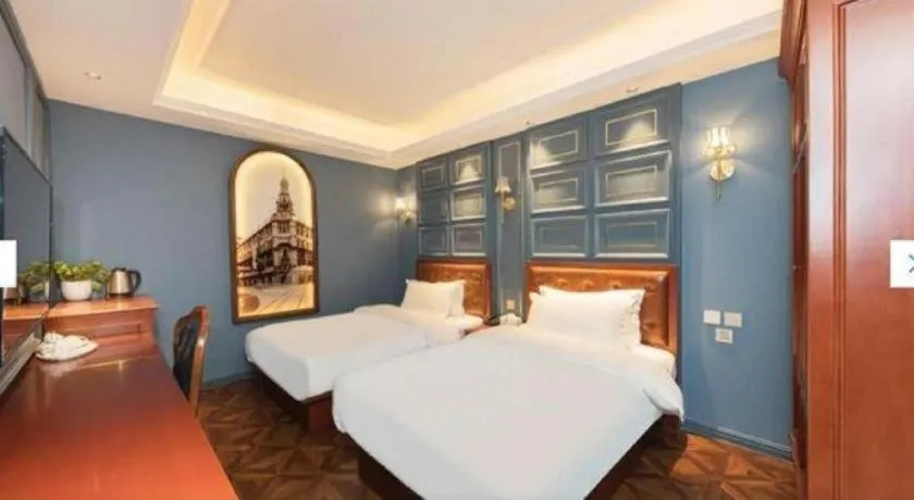 Bed in Yitingzhenshe Hotel Beijing Qianmen