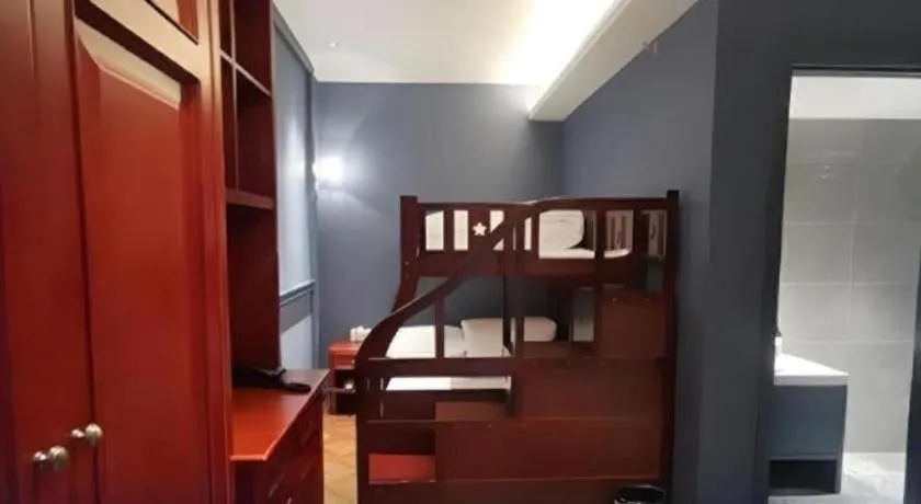 Bed in Yitingzhenshe Hotel Beijing Qianmen