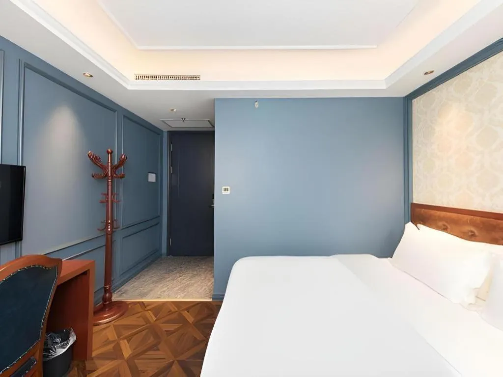 Bed in Yitingzhenshe Hotel Beijing Qianmen