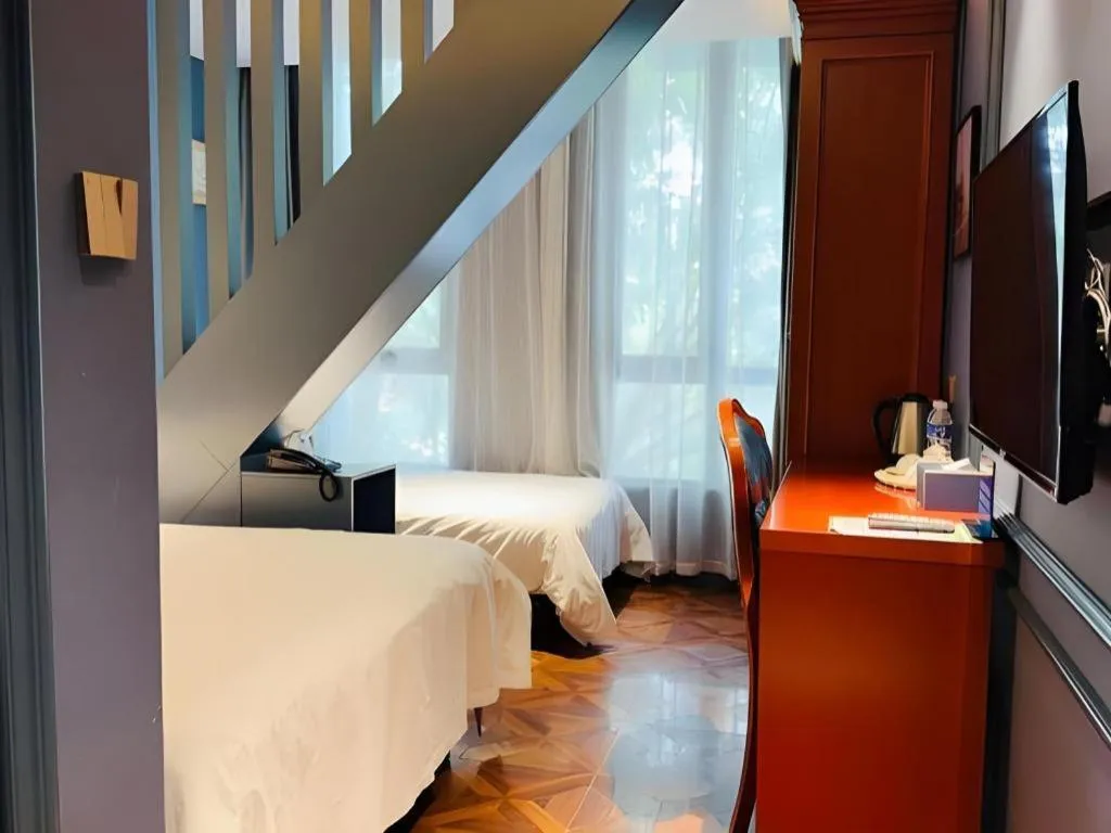 Bed in Yitingzhenshe Hotel Beijing Qianmen