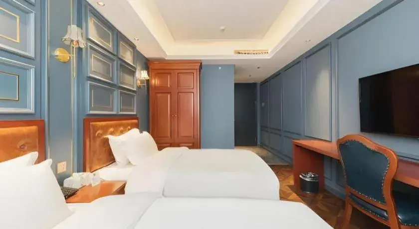 Bed in Yitingzhenshe Hotel Beijing Qianmen Bed in Yitingzhenshe Hotel Beijing Qianmen