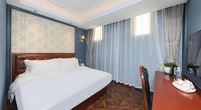 Bed in Yitingzhenshe Hotel Beijing Qianmen