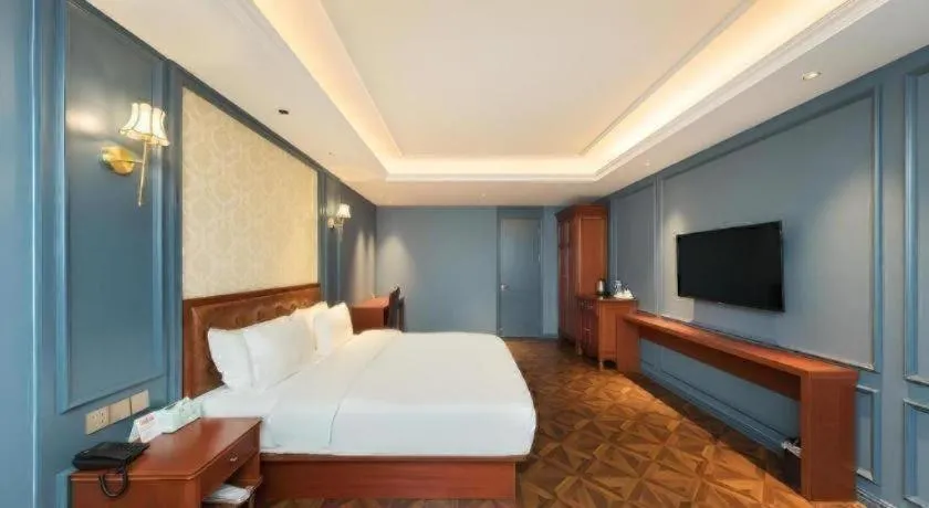 Bed in Yitingzhenshe Hotel Beijing Qianmen