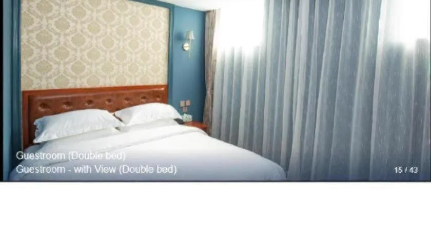 Bed in Yitingzhenshe Hotel Beijing Qianmen