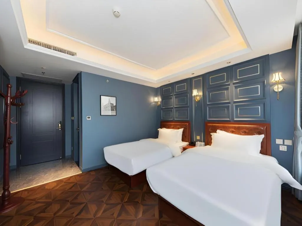 Bed in Yitingzhenshe Hotel Beijing Qianmen