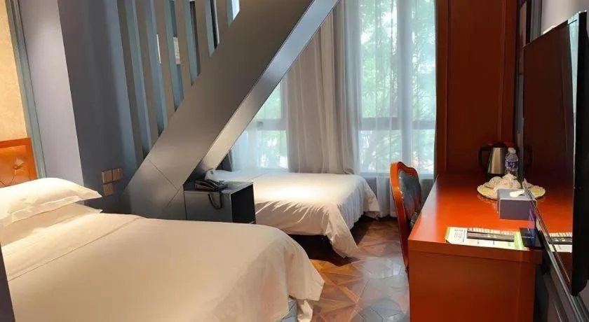 Bed in Yitingzhenshe Hotel Beijing Qianmen