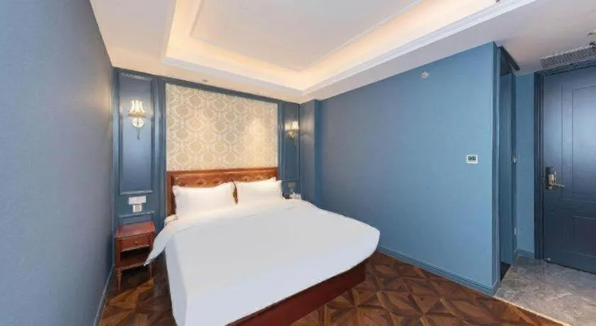 Bed in Yitingzhenshe Hotel Beijing Qianmen