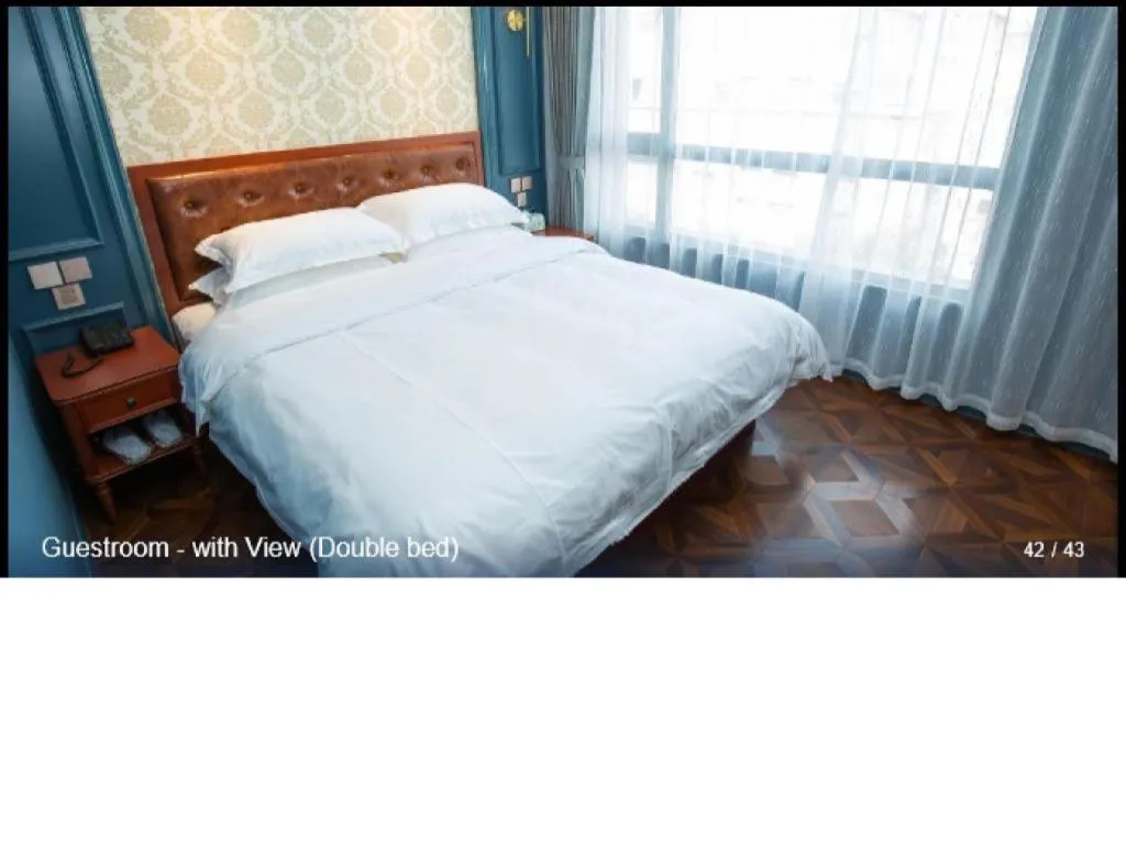 Bed in Yitingzhenshe Hotel Beijing Qianmen