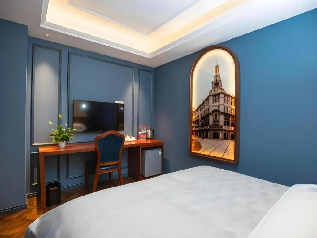 Bed in Yitingzhenshe Hotel Beijing Qianmen