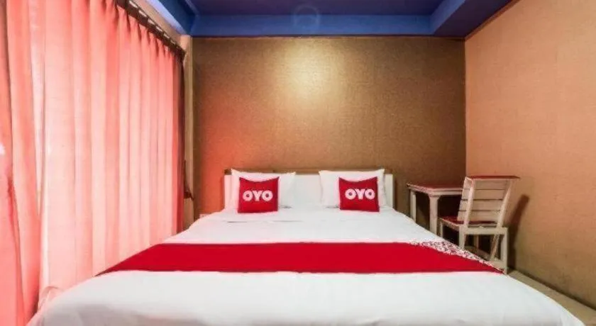 Bed in OYO 826 Cozy Rooms