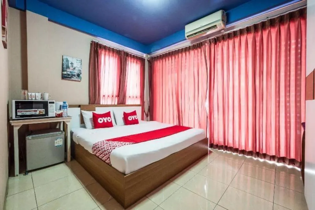 Bed in OYO 826 Cozy Rooms