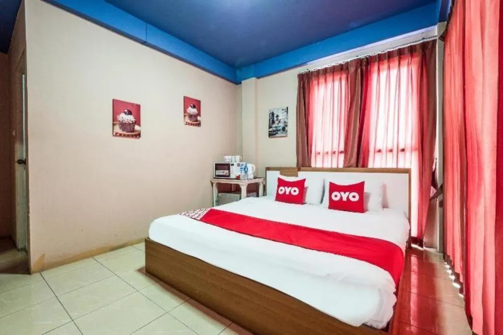 Bed in OYO 826 Cozy Rooms