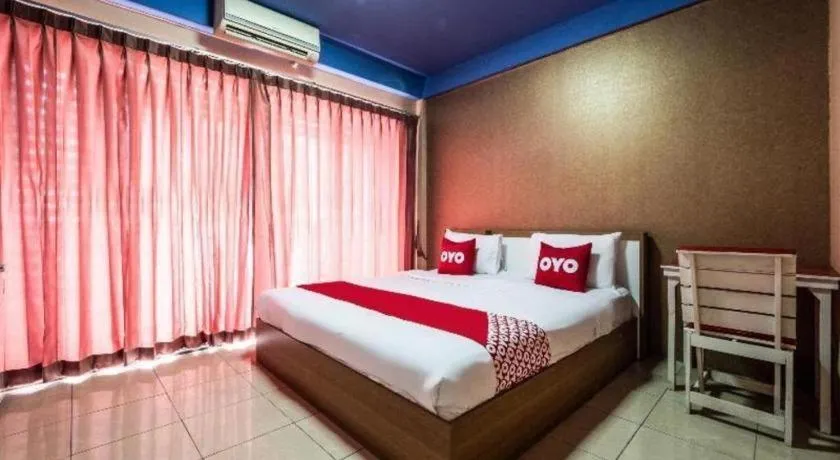 Bed in OYO 826 Cozy Rooms