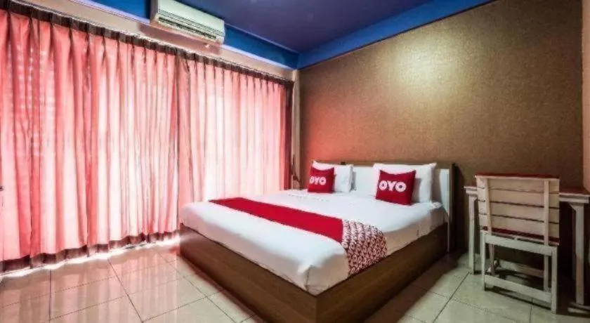 Bed in OYO 826 Cozy Rooms