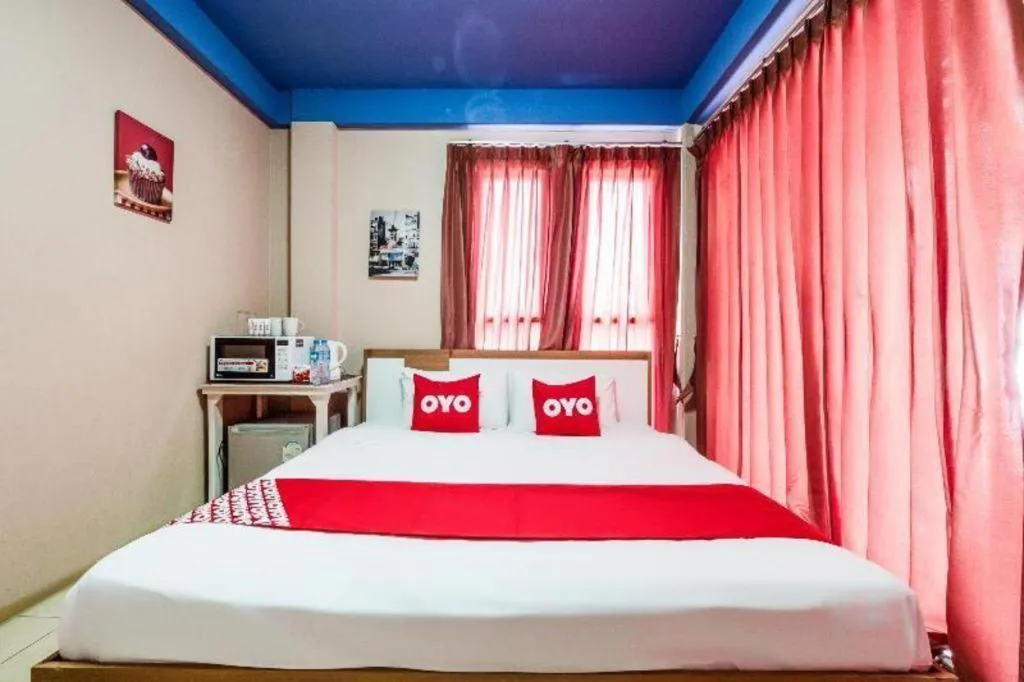 Bed in OYO 826 Cozy Rooms