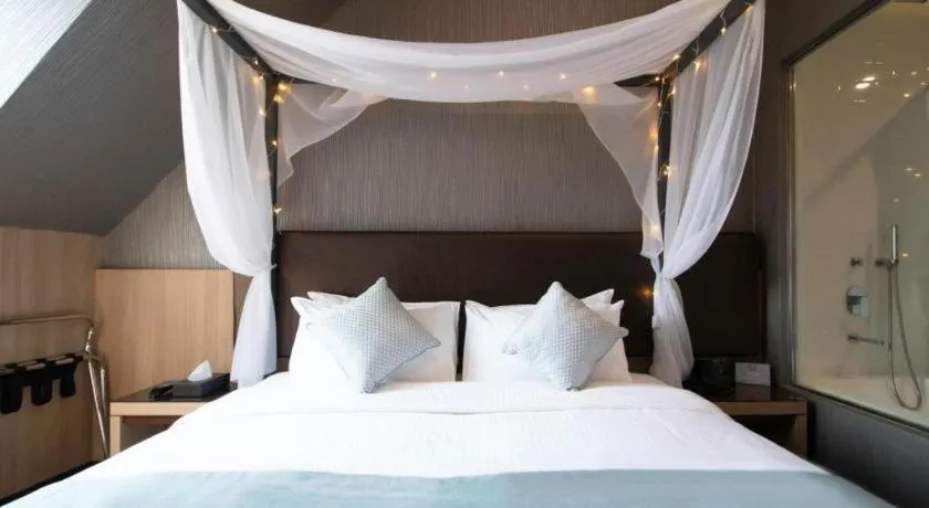 Bed in Hotel NuVe Stellar