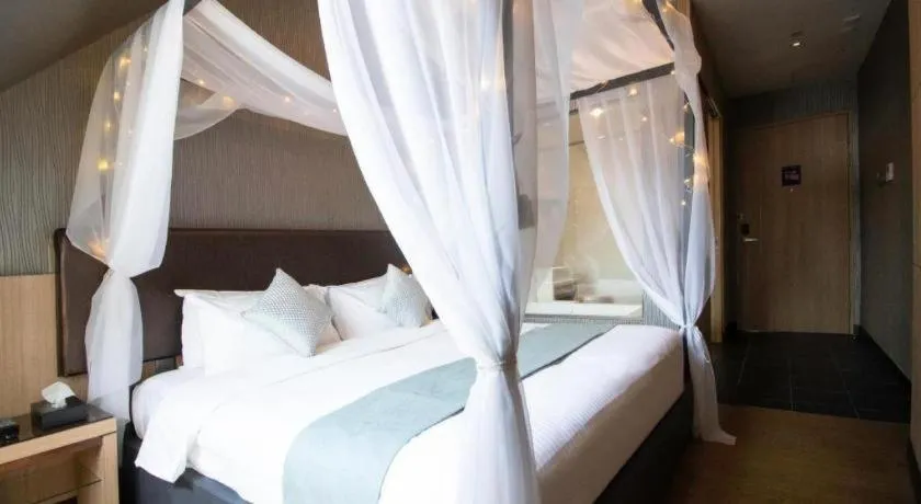 Bed in Hotel NuVe Stellar