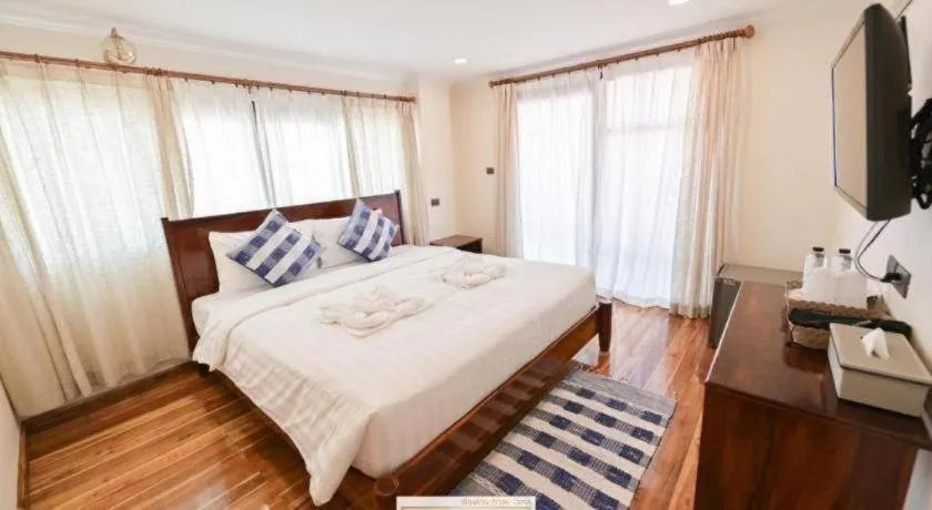 Bed in Chiangkhan Town Hotel