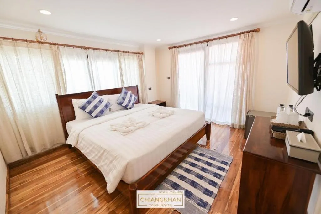Bed in Chiangkhan Town Hotel