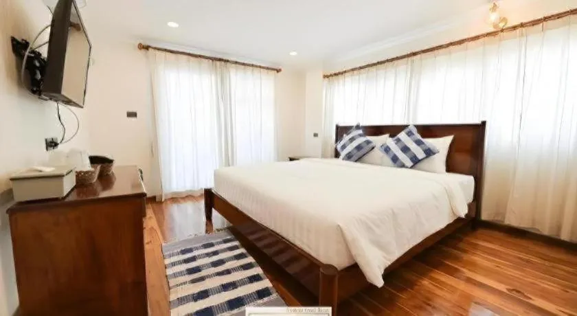 Bed in Chiangkhan Town Hotel