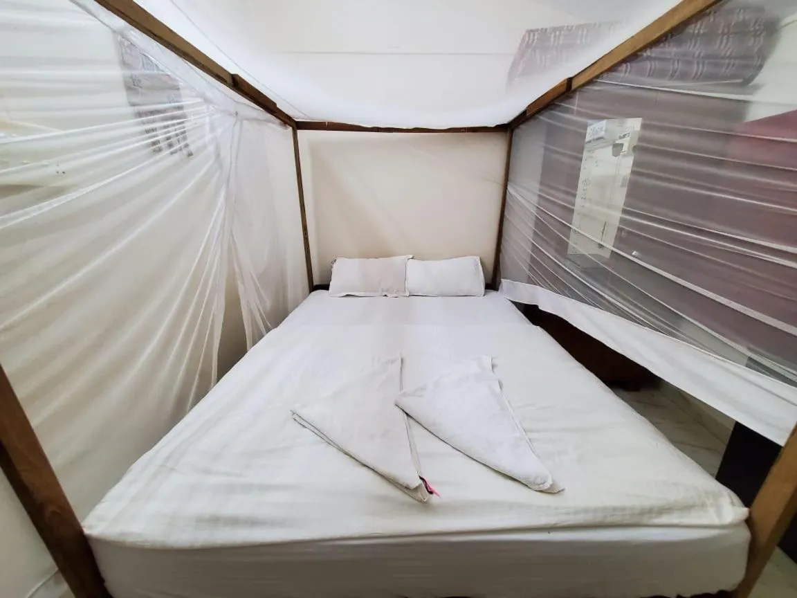 Bed in Cabo De Rama Cottage