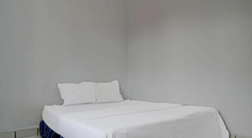 Bed in Hotel O Home Stay Syariah Aom Kusman