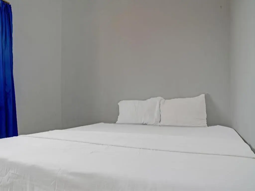 Bed in Hotel O Home Stay Syariah Aom Kusman Bed in Hotel O Home Stay Syariah Aom Kusman
