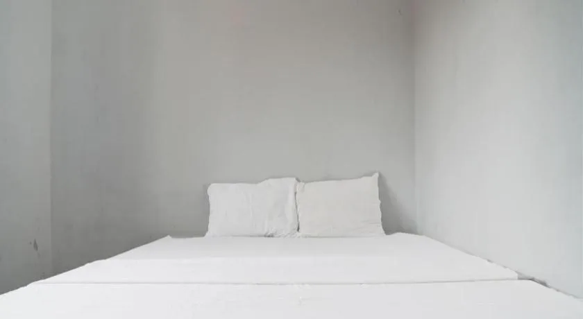 Bed in Hotel O Home Stay Syariah Aom Kusman
