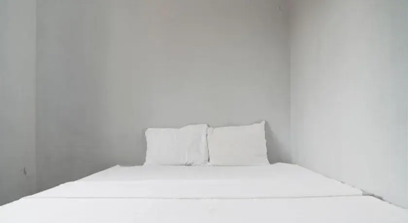 Bed in Hotel O Home Stay Syariah Aom Kusman Bed in Hotel O Home Stay Syariah Aom Kusman