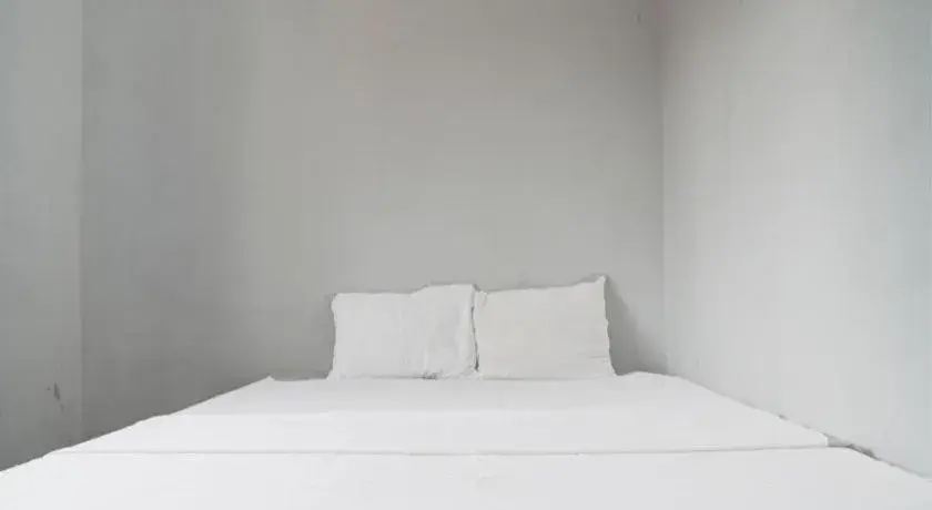 Bed in Hotel O Home Stay Syariah Aom Kusman Bed in Hotel O Home Stay Syariah Aom Kusman