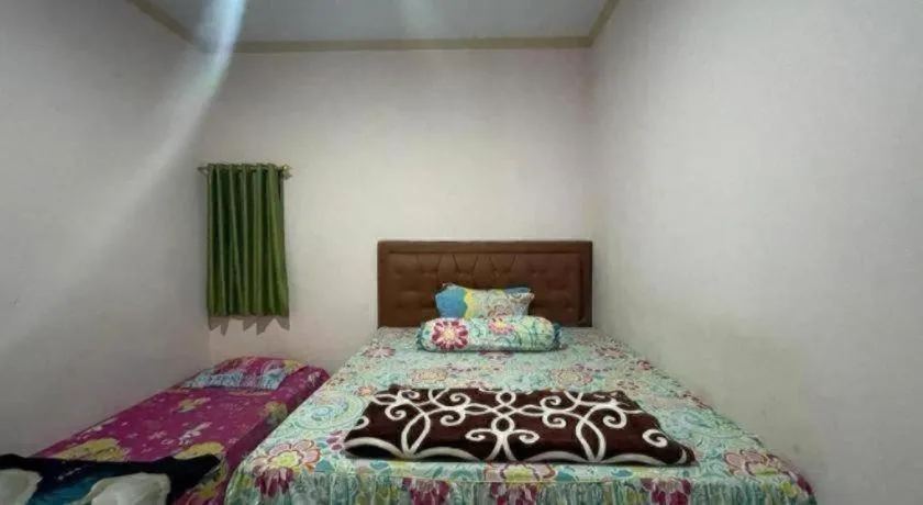 Bed in Hotel O Lima Saudara Syariah