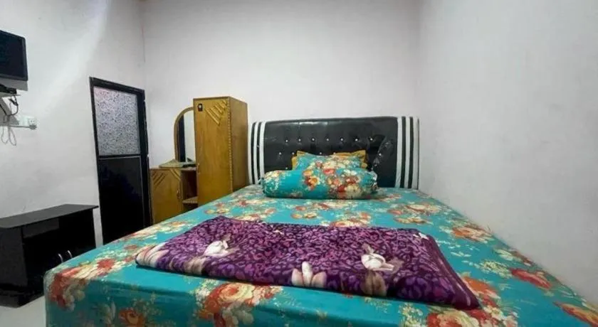 Bed in Hotel O Lima Saudara Syariah