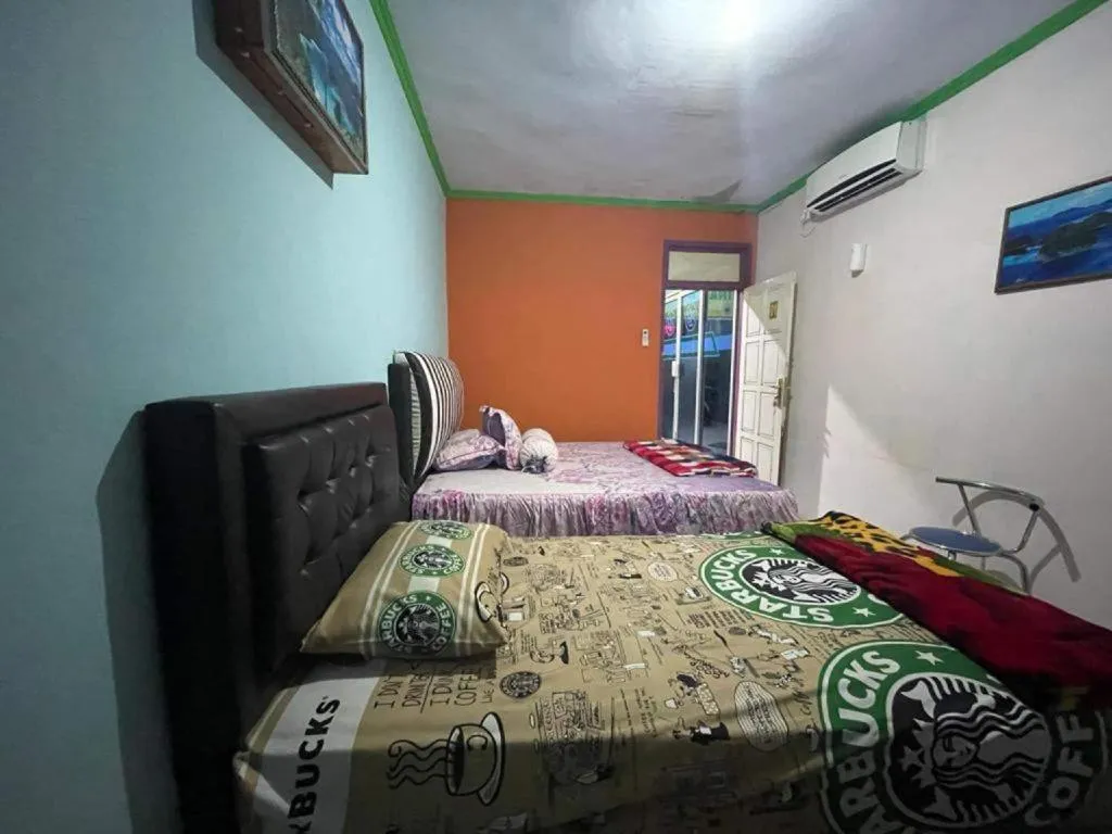 Bed in Hotel O Lima Saudara Syariah