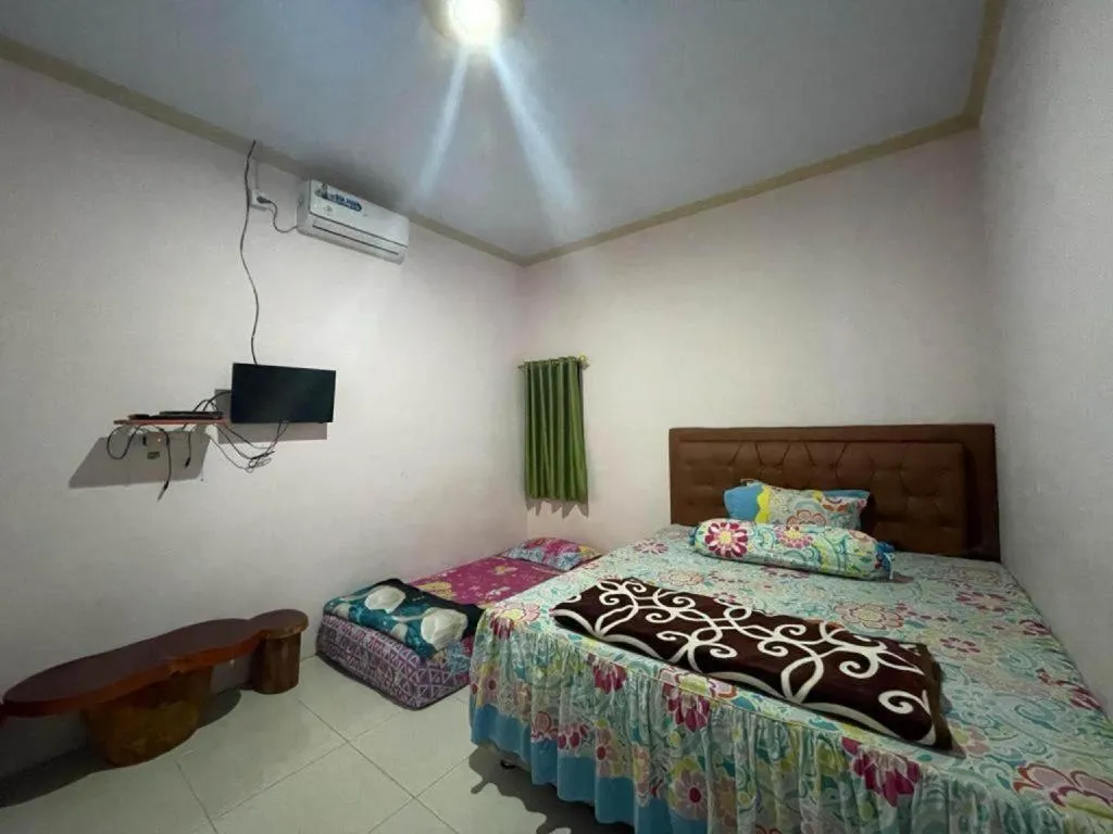 Bed in Hotel O Lima Saudara Syariah