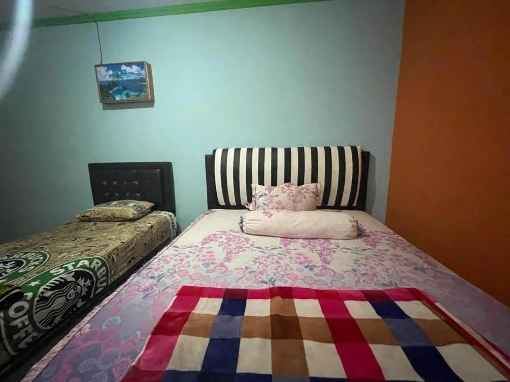 Bed in Hotel O Lima Saudara Syariah