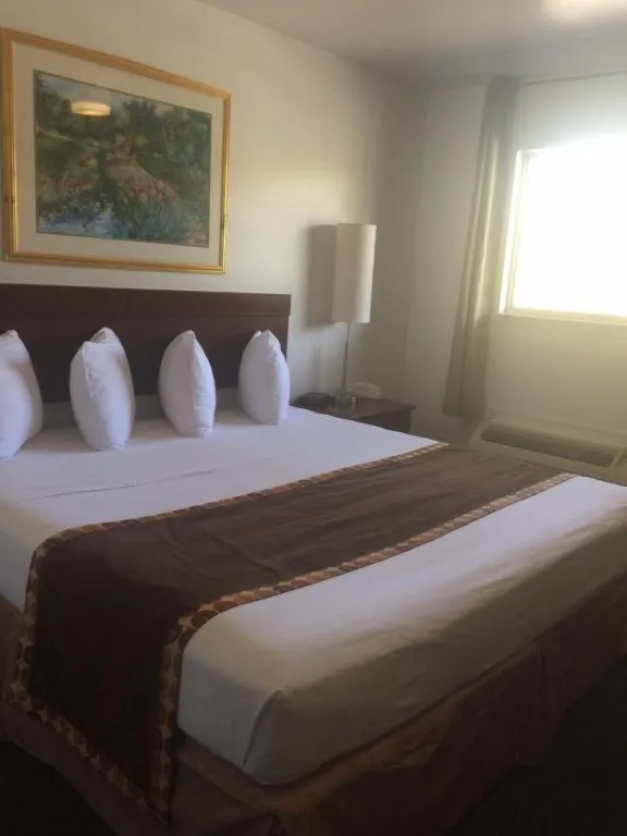 Bed in Sunstyle Suites