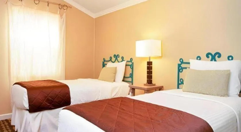 Bed in The Lafayette Hotel, Swim Club & Bungalows