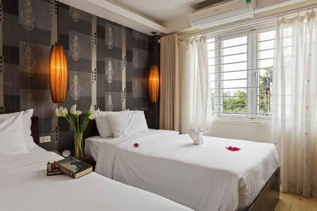 Bed in Hanoi Impressive Hotel