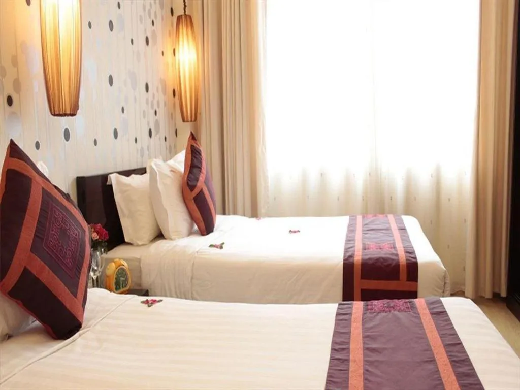 Bed in Hanoi Impressive Hotel