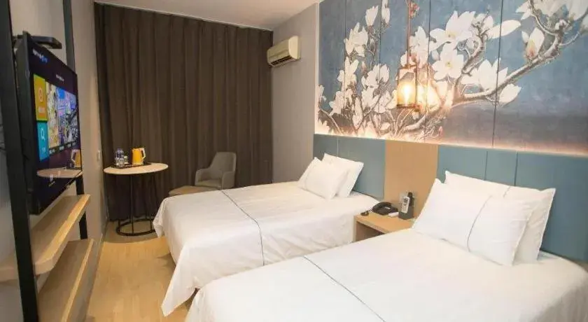 Bed in Jinjiang Inn Tianjin Station Jinwan Square Bed in Jinjiang Inn Tianjin Station Jinwan Square