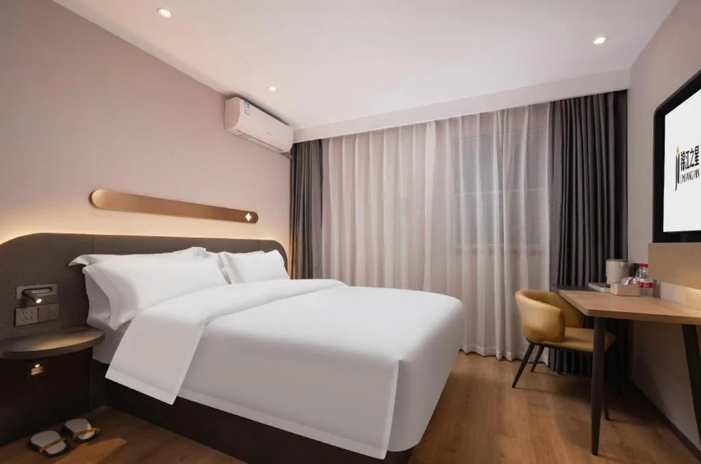 Bed in Jinjiang Inn Wuhan Hanjiang Road Metro Station Jiangtan Pedestrian Street