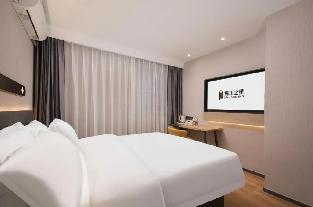 Bed in Jinjiang Inn Wuhan Hanjiang Road Metro Station Jiangtan Pedestrian Street