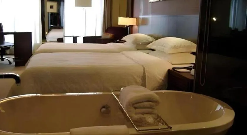 Bed in New Century Hangzhou Grand Hotel