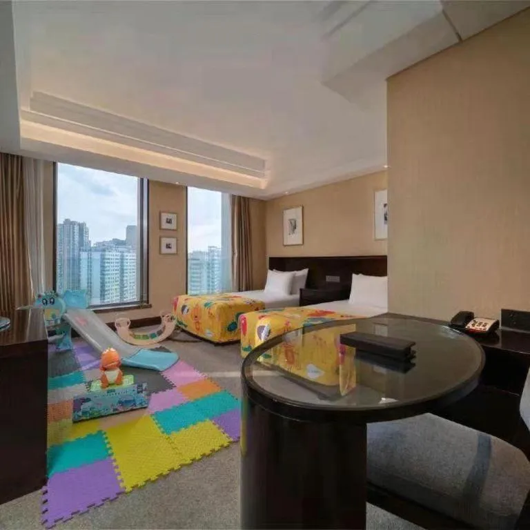 Bed in New Century Hangzhou Grand Hotel