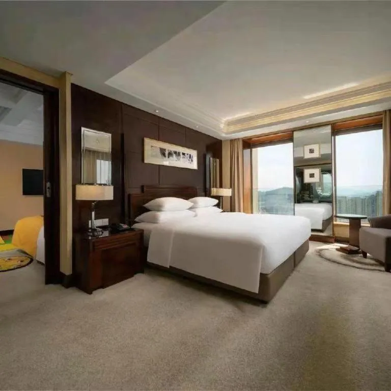 Bed in New Century Hangzhou Grand Hotel